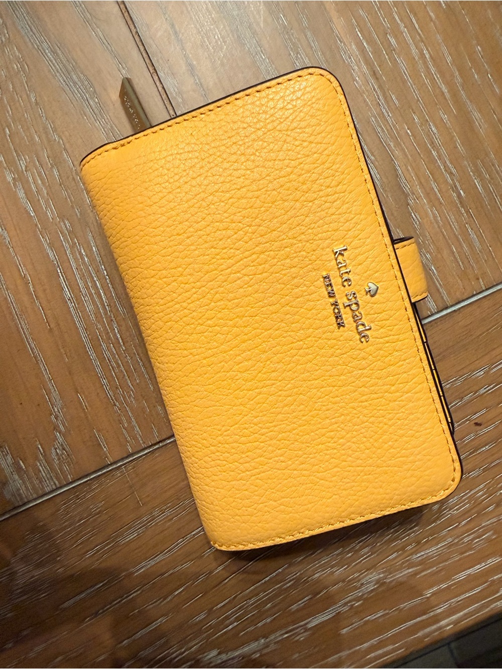 kate spade saffron pebbled leather compact wallet